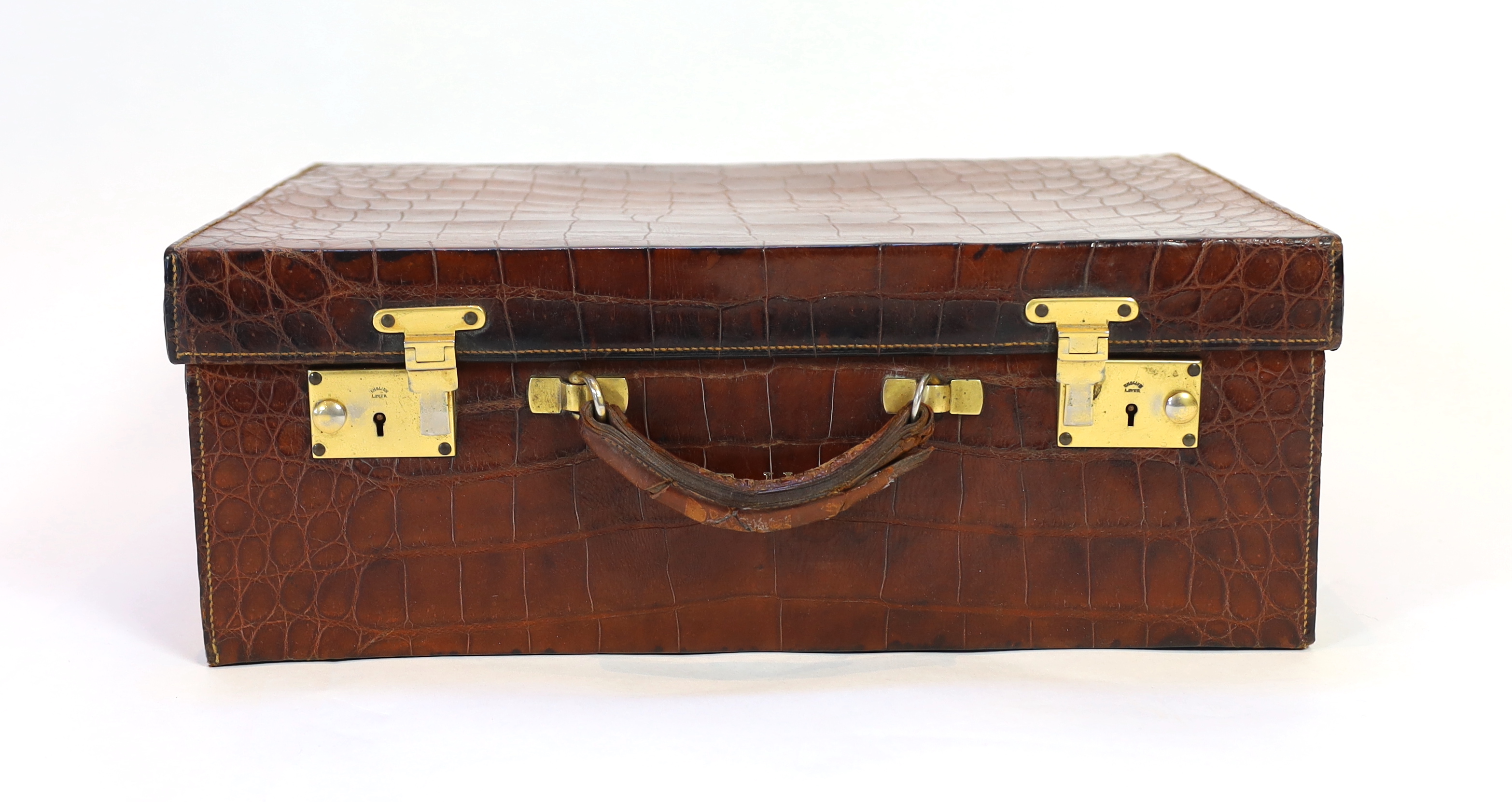 A 1920's crocodile skin suitcase, width 50cm, height 37cm, depth 19cm
